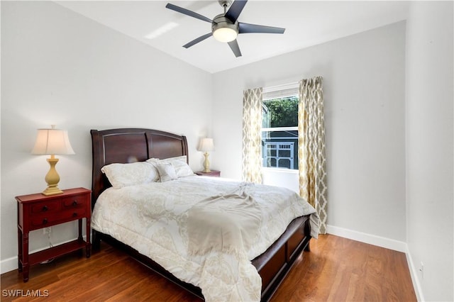 1420 14th Ave NE, Naples, FL 34120 - bedroom with wood finished floors, baseboards, and a ceiling fan