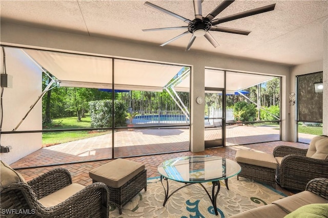 1420 14th Ave NE, Naples, FL 34120 - sunroom / solarium with ceiling fan and an outdoor living space