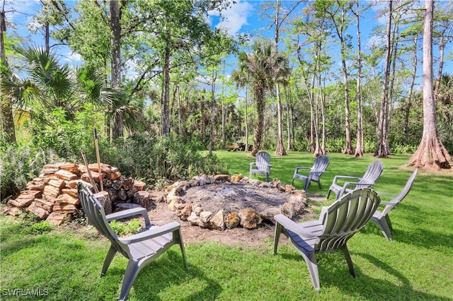 1420 14th Ave NE, Naples, FL 34120 - view of green lawn featuring an outdoor fire pit