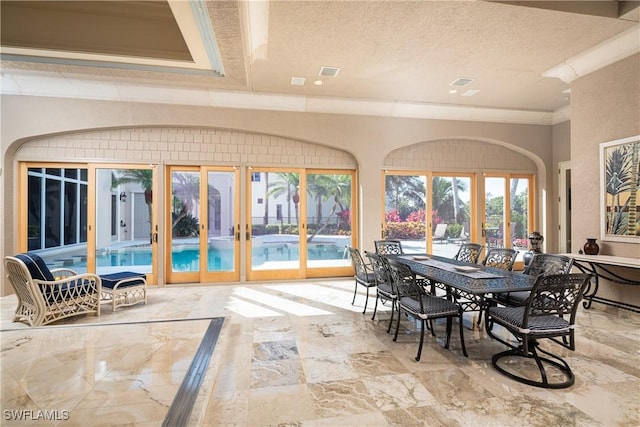 23771 Tuscany Way, Bonita Springs, FL 34134 - dining area with a textured ceiling, visible vents, french doors, and crown molding