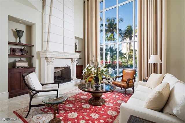23771 Tuscany Way, Bonita Springs, FL 34134 - living area featuring a fireplace