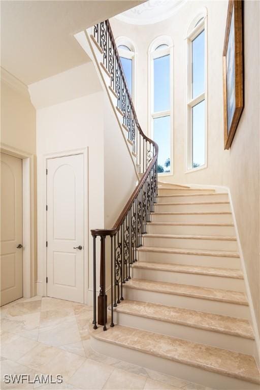 23771 Tuscany Way, Bonita Springs, FL 34134 - stairs with marble finish floor and ornamental molding