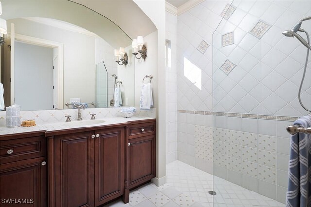 23771 Tuscany Way, Bonita Springs, FL 34134 - full bath with vanity, ornamental molding, and a walk in shower