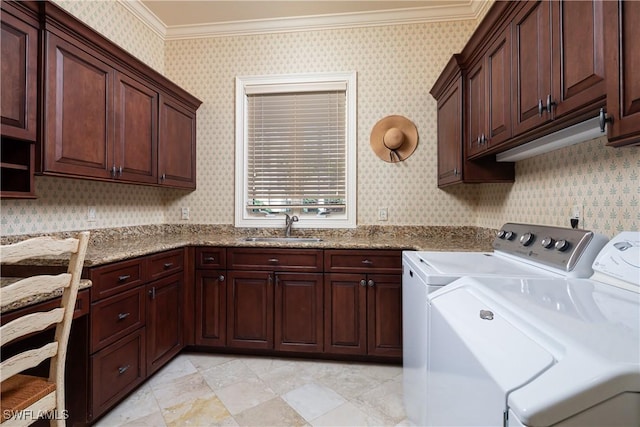 23771 Tuscany Way, Bonita Springs, FL 34134 - clothes washing area with washing machine and clothes dryer, crown molding, wallpapered walls, a sink, and cabinet space