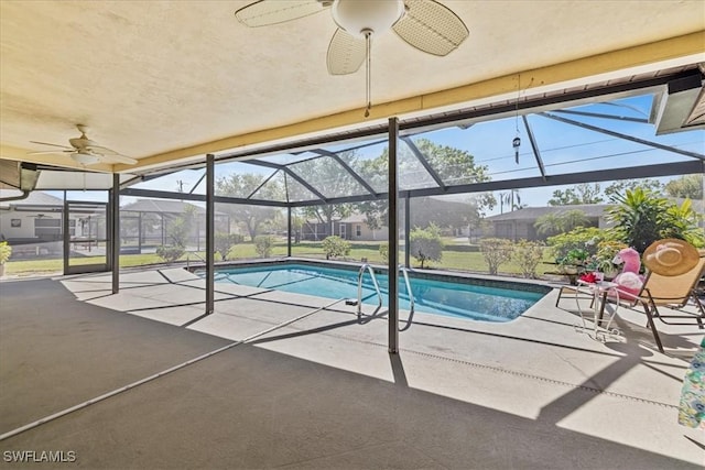 2220 SE 2nd Ter, Cape Coral, FL 33990 - outdoor pool with a ceiling fan, a patio, and glass enclosure