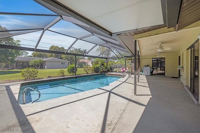 2220 SE 2nd Ter, Cape Coral, FL 33990 - outdoor pool featuring a patio area, ceiling fan, a lawn, and glass enclosure