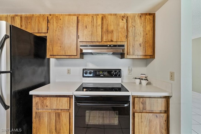 2220 SE 2nd Ter, Cape Coral, FL 33990 - kitchen featuring range with electric stovetop, freestanding refrigerator, range hood, light countertops, and tile patterned floors