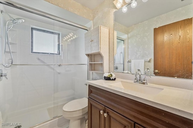 2220 SE 2nd Ter, Cape Coral, FL 33990 - bathroom featuring toilet, a shower stall, and vanity