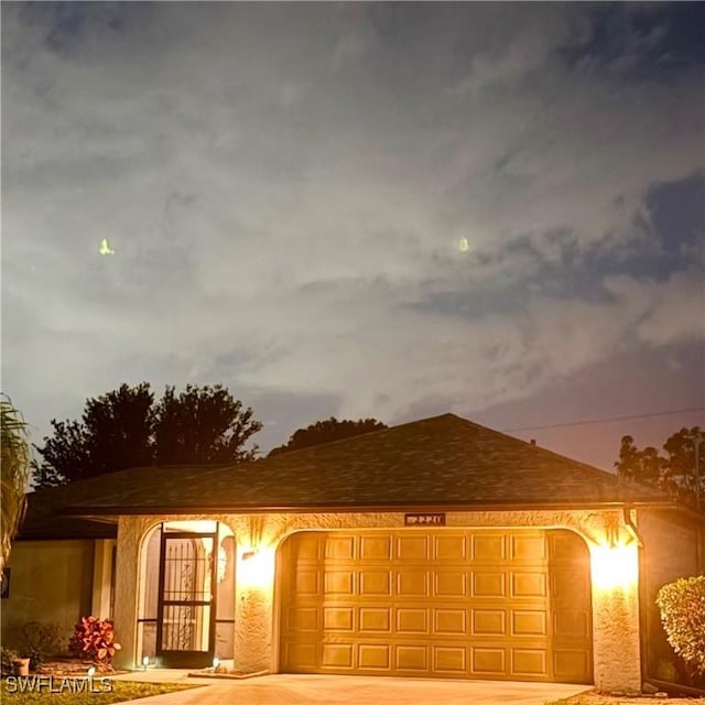2220 SE 2nd Ter, Cape Coral, FL 33990 - view of front of property featuring a garage and driveway