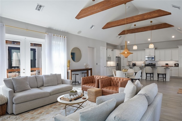 42207 Lake Timber Dr, Punta Gorda, FL 33982 - living room with beam ceiling, visible vents, and light wood-style flooring
