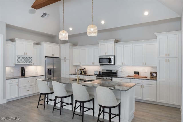 42207 Lake Timber Dr, Punta Gorda, FL 33982 - kitchen with visible vents, white cabinets, appliances with stainless steel finishes, and a sink