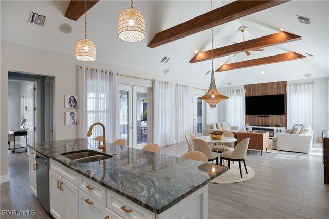 42207 Lake Timber Dr, Punta Gorda, FL 33982 - kitchen featuring beam ceiling, light wood-style floors, visible vents, and a sink