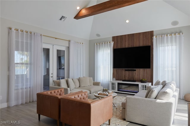 42207 Lake Timber Dr, Punta Gorda, FL 33982 - living area featuring light wood finished floors, visible vents, beamed ceiling, recessed lighting, and french doors