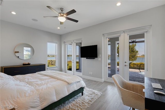 42207 Lake Timber Dr, Punta Gorda, FL 33982 - bedroom featuring light wood-style flooring, recessed lighting, french doors, baseboards, and access to exterior
