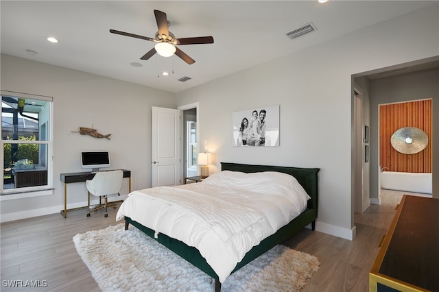 42207 Lake Timber Dr, Punta Gorda, FL 33982 - bedroom featuring a ceiling fan, visible vents, wood finished floors, baseboards, and recessed lighting