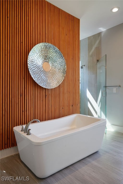 42207 Lake Timber Dr, Punta Gorda, FL 33982 - bathroom featuring a soaking tub, recessed lighting, and walk in shower