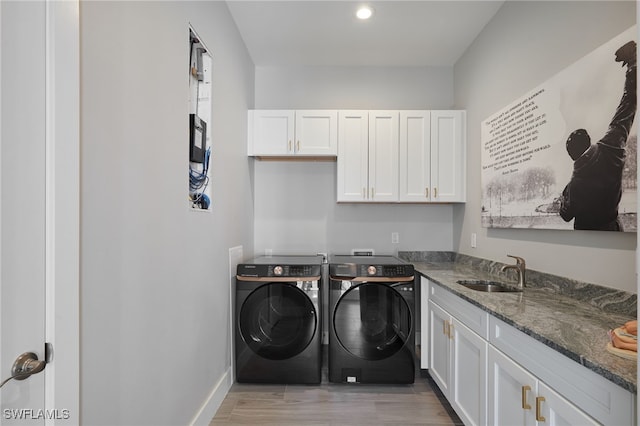 42207 Lake Timber Dr, Punta Gorda, FL 33982 - laundry room featuring baseboards, recessed lighting, cabinet space, independent washer and dryer, and a sink