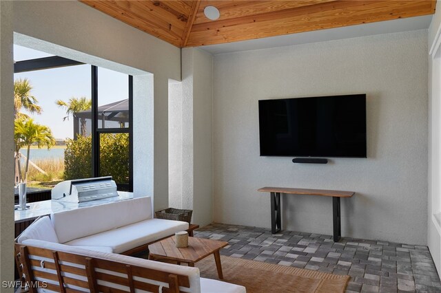 42207 Lake Timber Dr, Punta Gorda, FL 33982 - interior space featuring a lanai, a grill, and outdoor lounge area