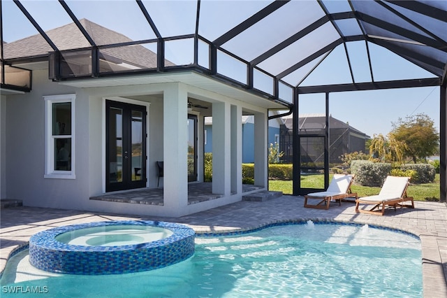 42207 Lake Timber Dr, Punta Gorda, FL 33982 - view of swimming pool with french doors, a pool with connected hot tub, a patio, and a ceiling fan