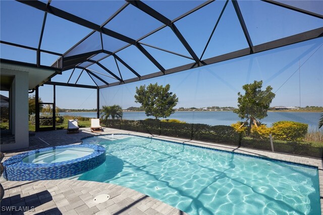42207 Lake Timber Dr, Punta Gorda, FL 33982 - view of pool with a lanai, a pool with connected hot tub, a patio, and a water view