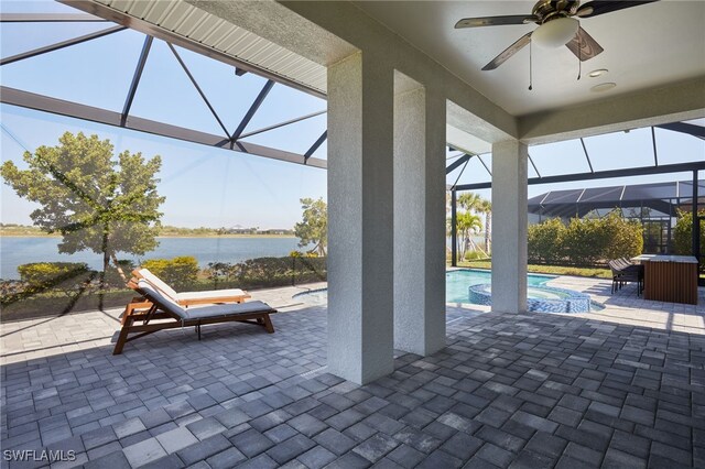 42207 Lake Timber Dr, Punta Gorda, FL 33982 - view of patio / terrace with a water view, a pool with connected hot tub, glass enclosure, outdoor dining area, and ceiling fan