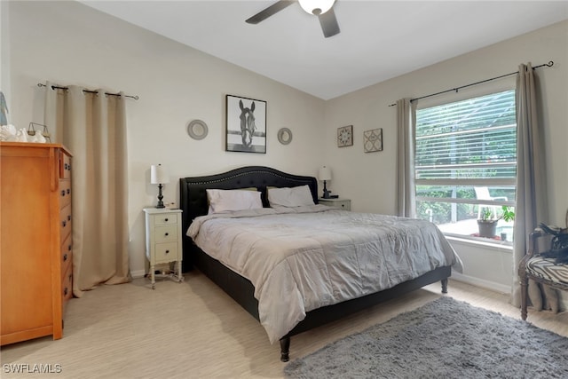15501 Cortona Way, Naples, FL 34120 - bedroom featuring vaulted ceiling, light wood-style floors, baseboards, and ceiling fan