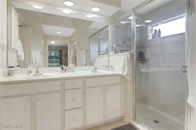 15501 Cortona Way, Naples, FL 34120 - bathroom featuring double vanity, a shower stall, and recessed lighting