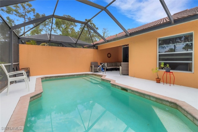 15501 Cortona Way, Naples, FL 34120 - view of swimming pool with a patio, glass enclosure, and an outdoor hangout area