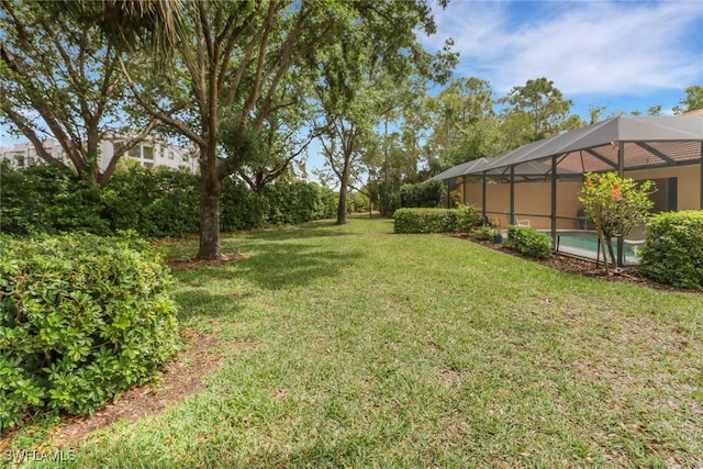 15501 Cortona Way, Naples, FL 34120 - view of grassy yard featuring glass enclosure