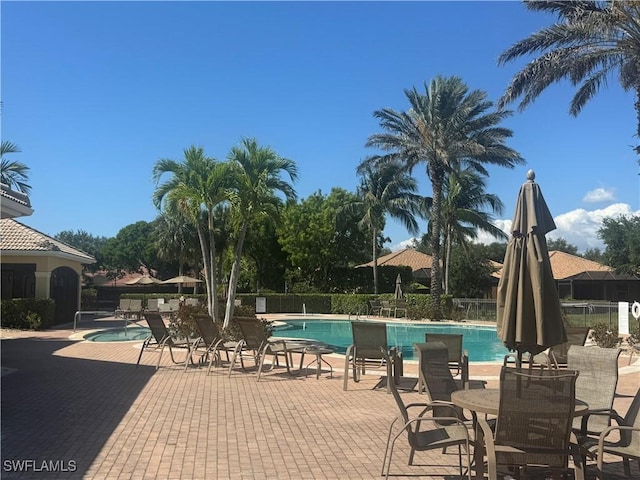 15501 Cortona Way, Naples, FL 34120 - community pool featuring fence and a patio