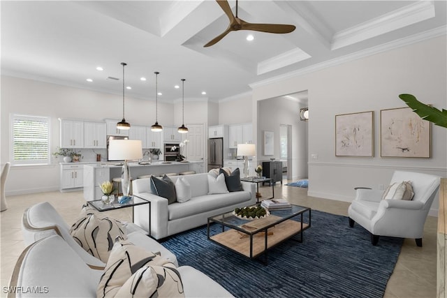 living area with crown molding, light tile patterned floors, a towering ceiling, a ceiling fan, and coffered ceiling