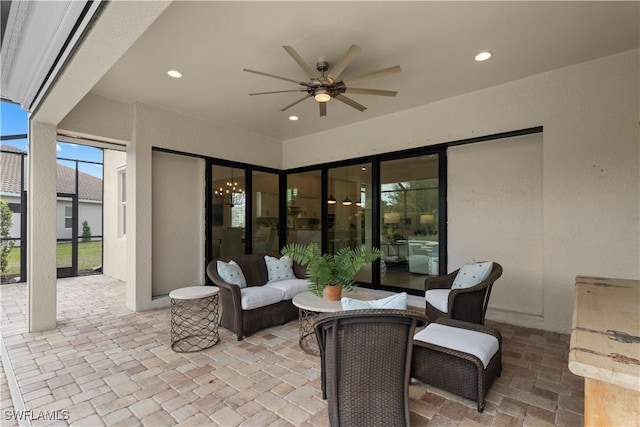 view of patio with ceiling fan and a lanai