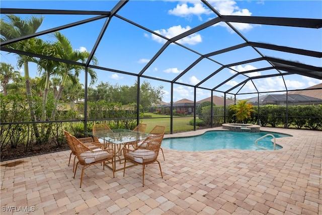 view of swimming pool featuring a lanai, a patio, and a pool with connected hot tub
