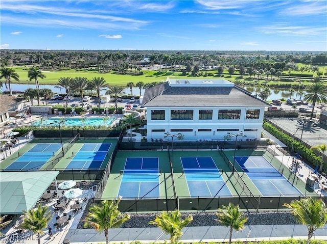 aerial view featuring view of golf course and a water view