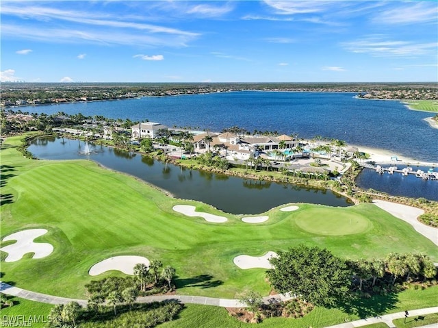 bird's eye view featuring a water view and view of golf course