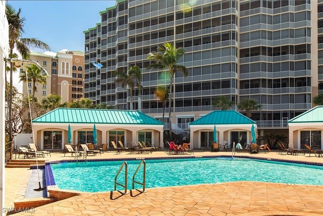 4141 Bay Beach Ln Unit 475, Fort Myers Beach, FL 33931 - community pool featuring a patio