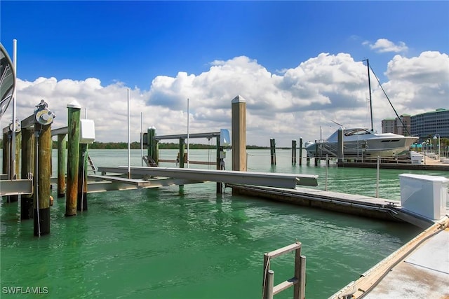 4141 Bay Beach Ln Unit 475, Fort Myers Beach, FL 33931 - dock area featuring boat lift and a water view
