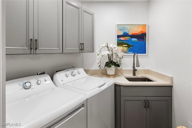 4141 Bay Beach Ln Unit 475, Fort Myers Beach, FL 33931 - washroom featuring a sink, separate washer and dryer, and cabinet space