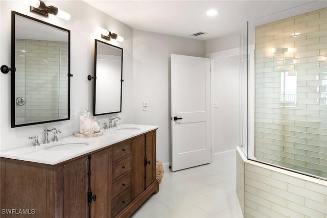 4141 Bay Beach Ln Unit 475, Fort Myers Beach, FL 33931 - bathroom featuring a sink, double vanity, visible vents, and tile patterned flooring