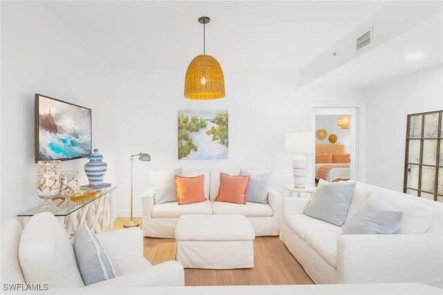 4141 Bay Beach Ln Unit 475, Fort Myers Beach, FL 33931 - living area with light wood-style flooring and visible vents