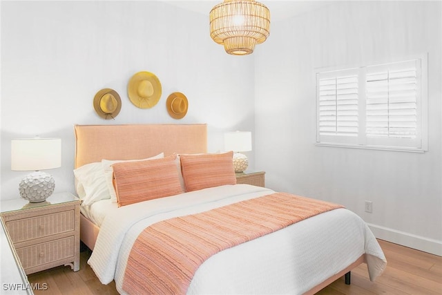 4141 Bay Beach Ln Unit 475, Fort Myers Beach, FL 33931 - bedroom featuring wood finished floors and baseboards