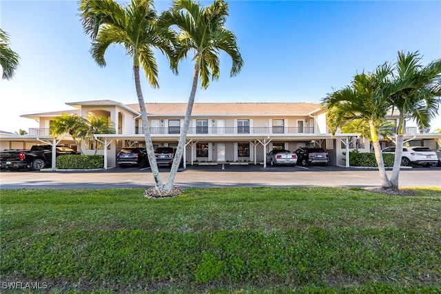 912 SW 48th Ter Unit 108, Cape Coral, FL 33914 - view of front of house with covered parking and a front lawn