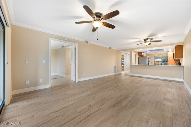 912 SW 48th Ter Unit 108, Cape Coral, FL 33914 - unfurnished living room with ceiling fan, light wood-type flooring, a sink, crown molding, and baseboards