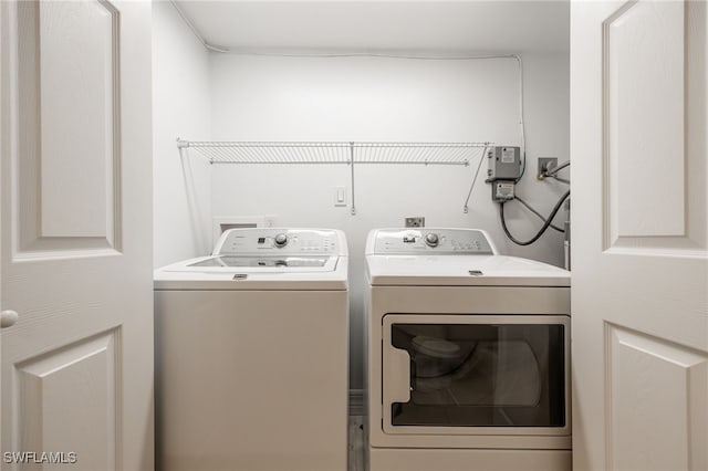 912 SW 48th Ter Unit 108, Cape Coral, FL 33914 - clothes washing area with washing machine and dryer