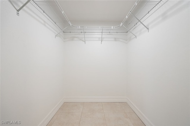 912 SW 48th Ter Unit 108, Cape Coral, FL 33914 - spacious closet featuring light tile patterned flooring