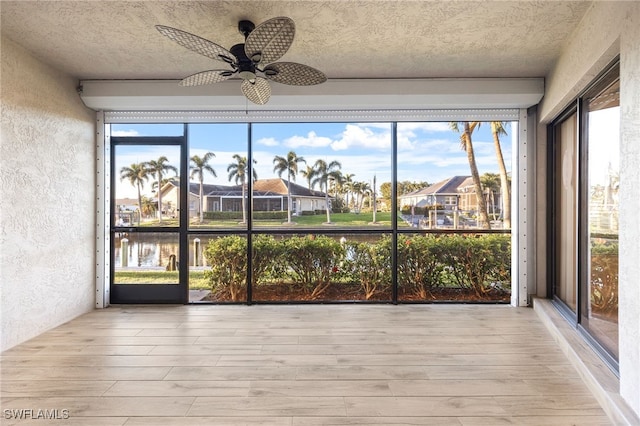 912 SW 48th Ter Unit 108, Cape Coral, FL 33914 - unfurnished sunroom featuring a residential view, a water view, and healthy amount of natural light