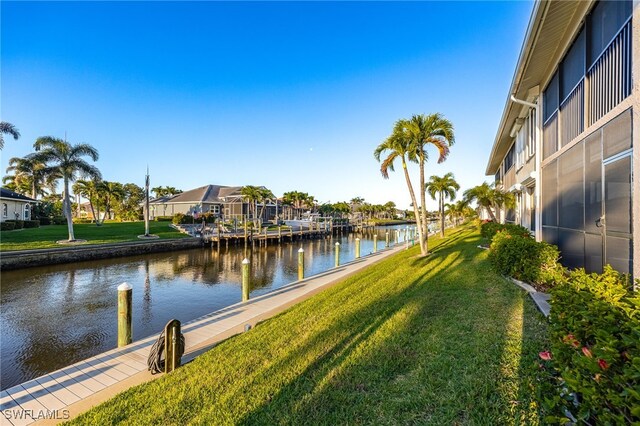 912 SW 48th Ter Unit 108, Cape Coral, FL 33914 - dock with a water view, a residential view, and a yard
