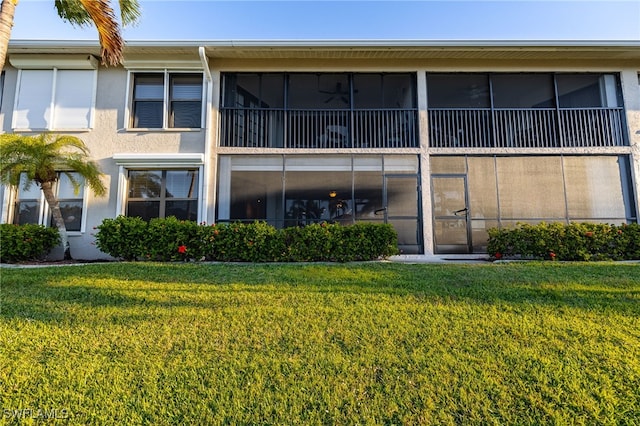 912 SW 48th Ter Unit 108, Cape Coral, FL 33914 - rear view of property with a yard and stucco siding