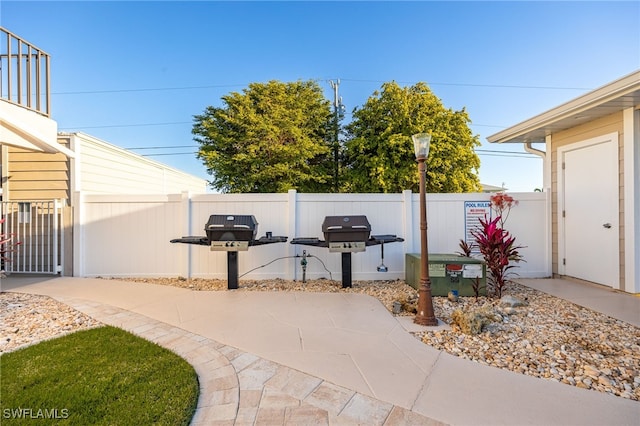 912 SW 48th Ter Unit 108, Cape Coral, FL 33914 - view of patio featuring fence and area for grilling