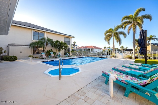 912 SW 48th Ter Unit 108, Cape Coral, FL 33914 - community pool featuring a patio area, fence, and a residential view